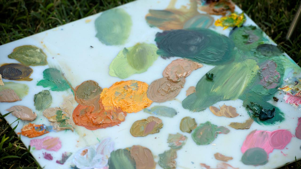 Canvas with several paint swatches from an art activity. 