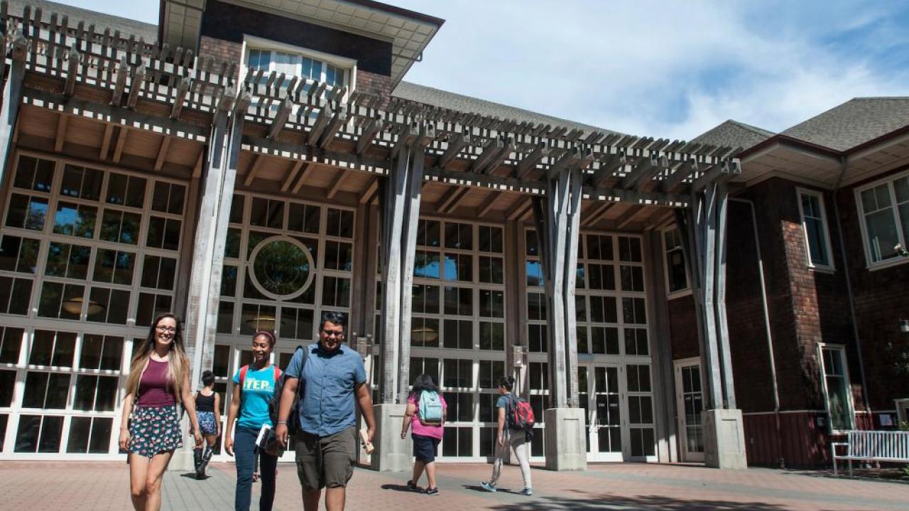 Image of students leaving Dutton Hall, where the financial aid office is located.